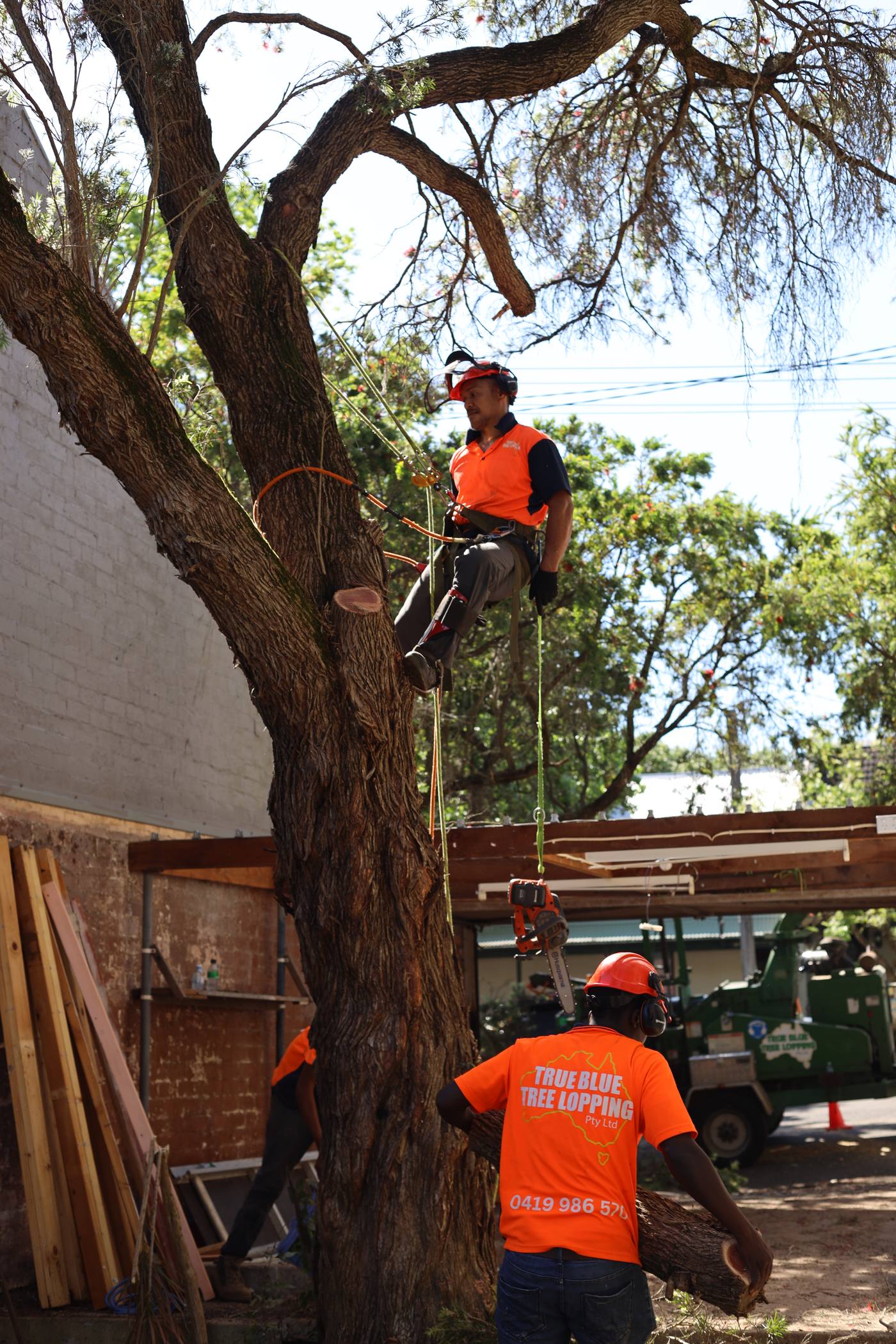 Ground crew clearing cuttings during a job