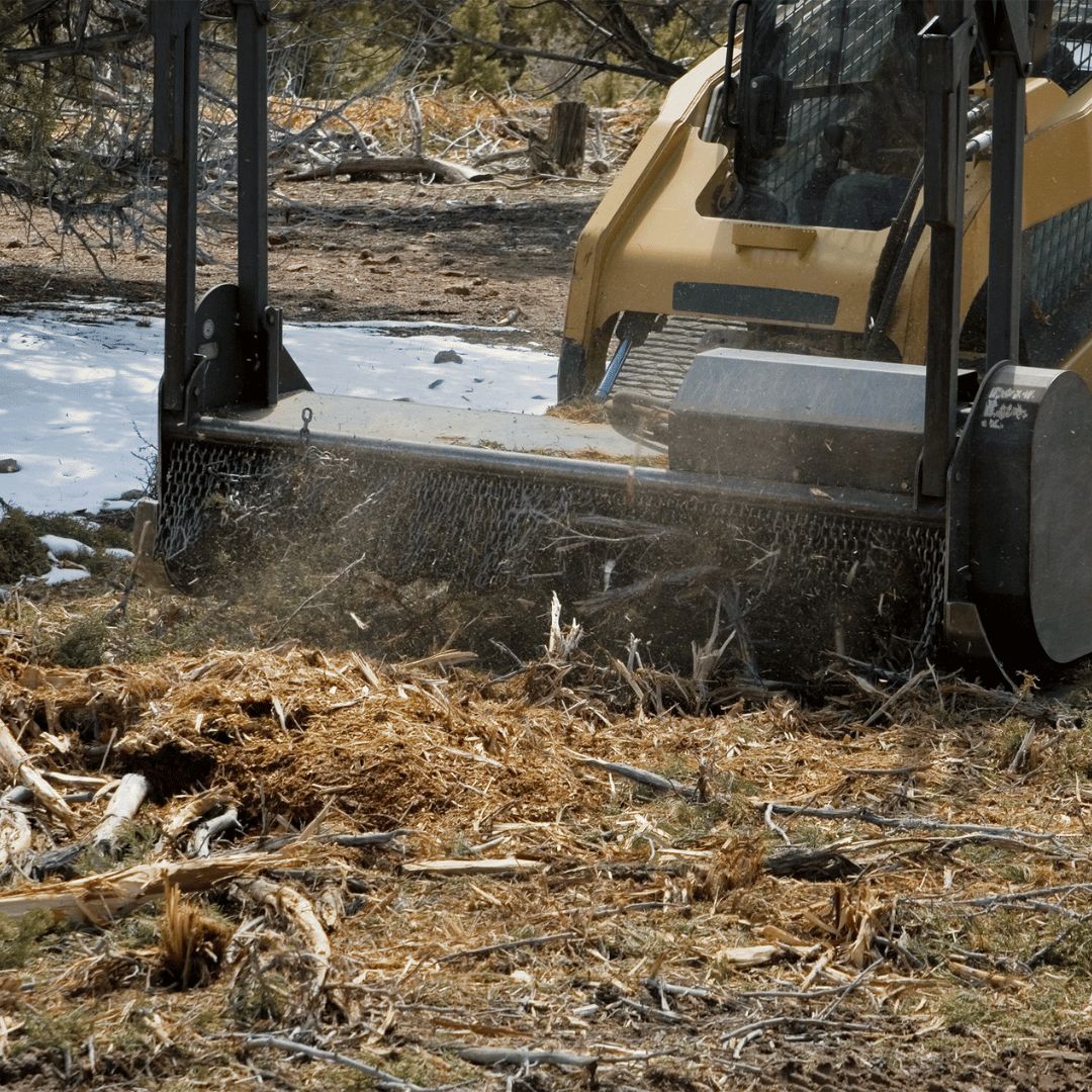 Mulching machine processing green waste on site